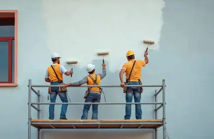 three-men-paint-building-wall-rollers-scaffolding-workers-wearing-workwear-safety-gear-hard-hats-construction-site-385631649 three-men-paint-building-wall-rollers-scaffolding-workers-wearing-workwear-safety-gear-hard-hats-construction-site-385631649